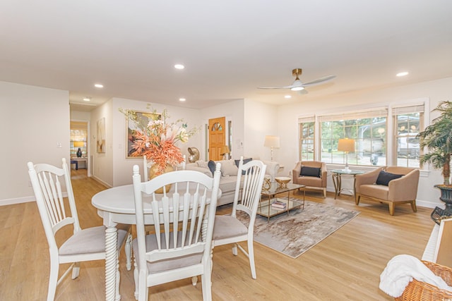 dining room featuring light hardwood / wood-style floors and ceiling fan