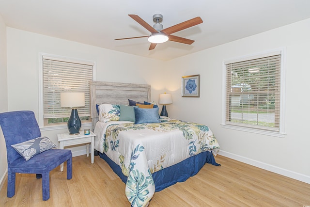 bedroom featuring ceiling fan and light hardwood / wood-style flooring