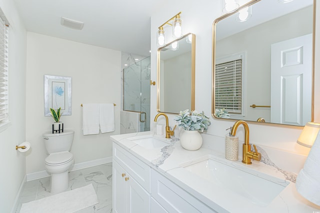 bathroom with toilet, vanity, and walk in shower