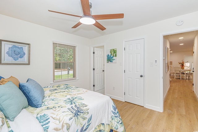 bedroom featuring light hardwood / wood-style flooring and ceiling fan