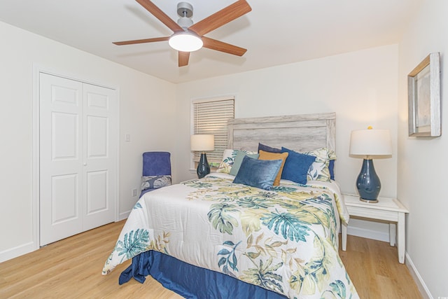 bedroom featuring ceiling fan, a closet, and light hardwood / wood-style floors