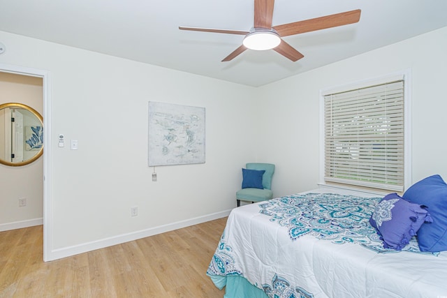 bedroom with ceiling fan and light hardwood / wood-style floors