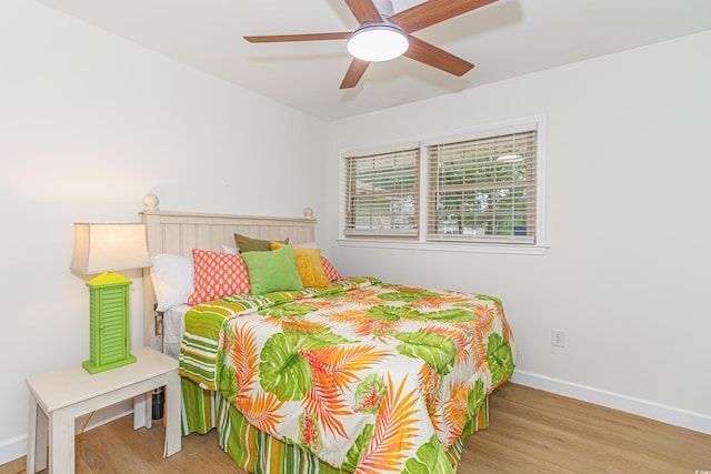 bedroom featuring light hardwood / wood-style floors and ceiling fan