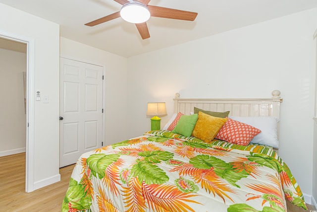 bedroom featuring ceiling fan and light hardwood / wood-style flooring