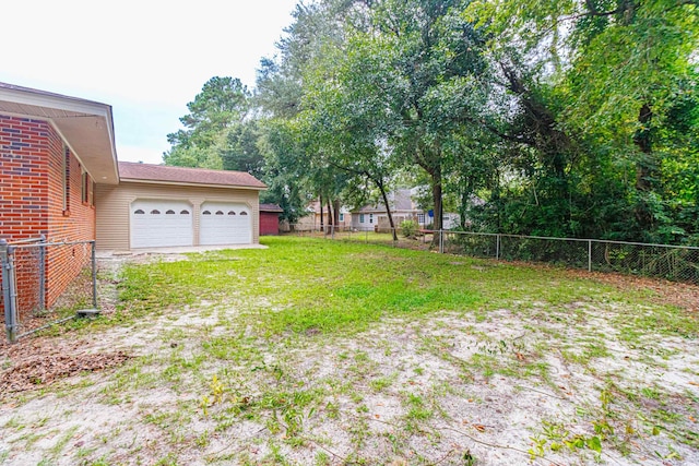 view of yard featuring a garage