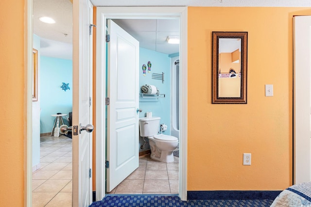 hallway featuring light tile patterned flooring