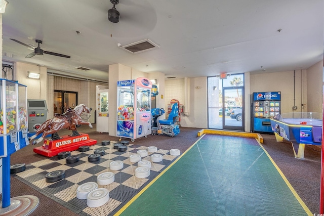 playroom featuring ceiling fan and carpet floors