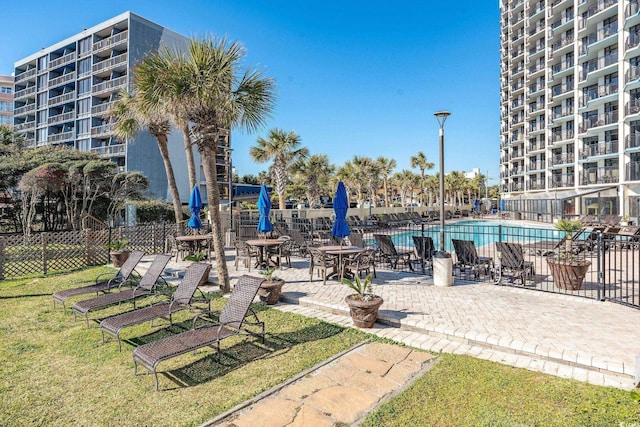 view of home's community with a patio and a pool