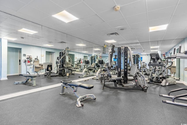 exercise room featuring a paneled ceiling