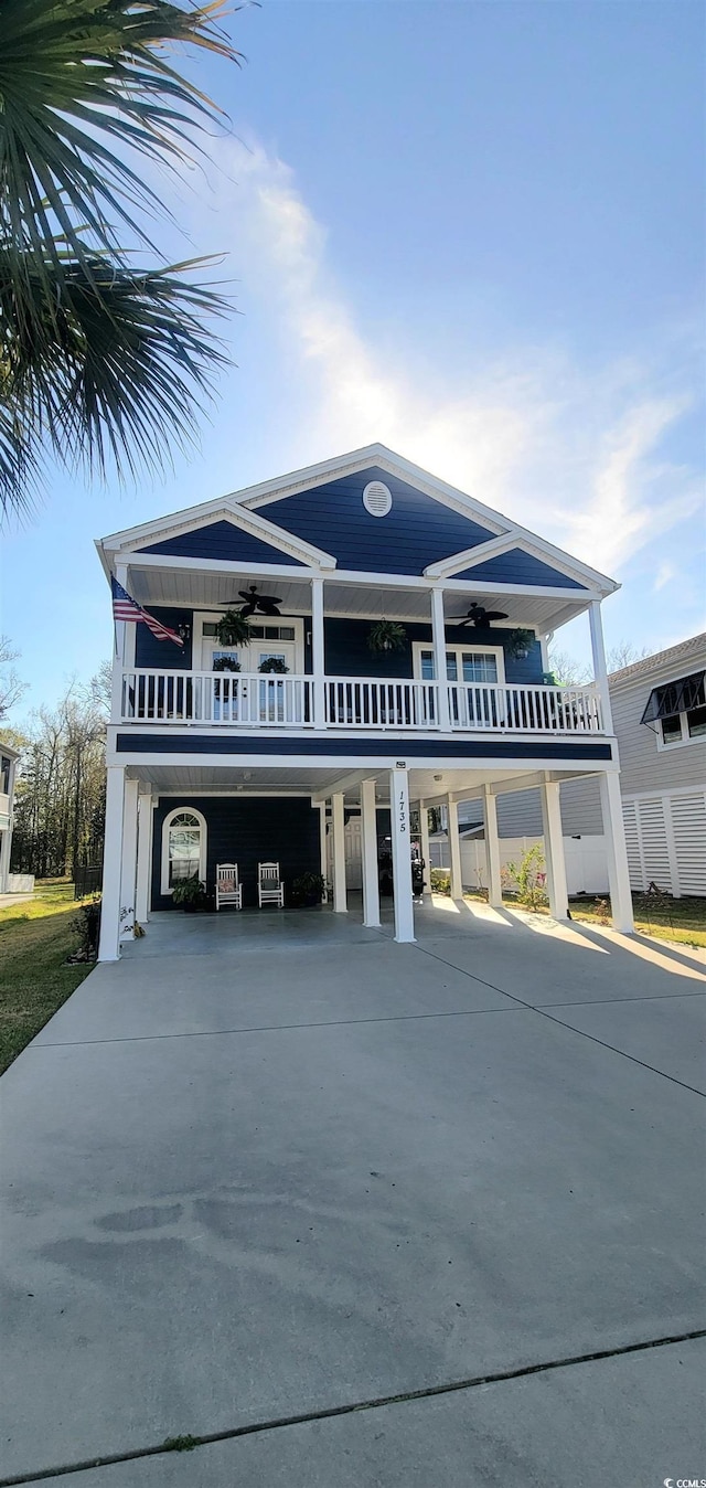 beach home with a carport and ceiling fan