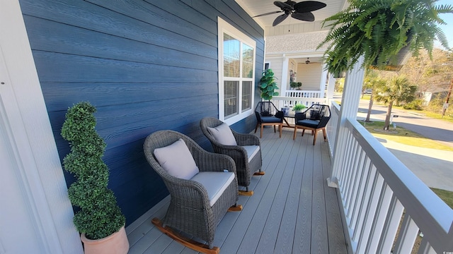 deck featuring a porch and ceiling fan