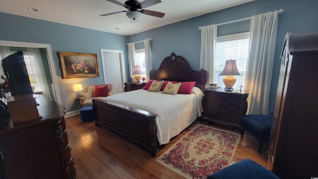 bedroom featuring ceiling fan and dark hardwood / wood-style flooring