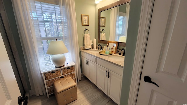 bathroom featuring wood-type flooring and vanity