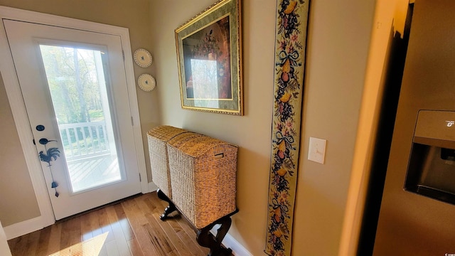 doorway with light hardwood / wood-style flooring