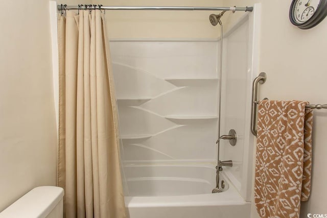 bathroom featuring shower / bathtub combination with curtain and toilet