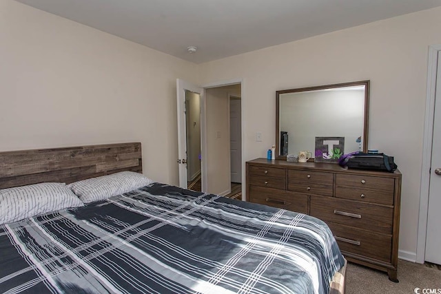 bedroom with light colored carpet