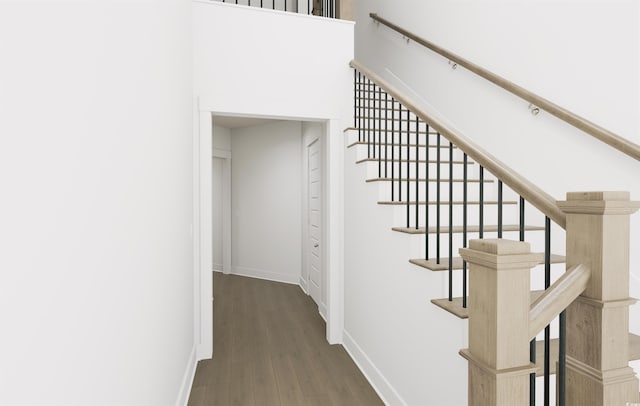 staircase featuring hardwood / wood-style floors