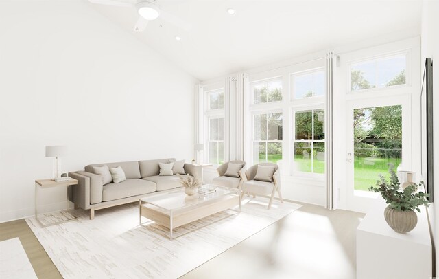 living room featuring ceiling fan with notable chandelier and high vaulted ceiling