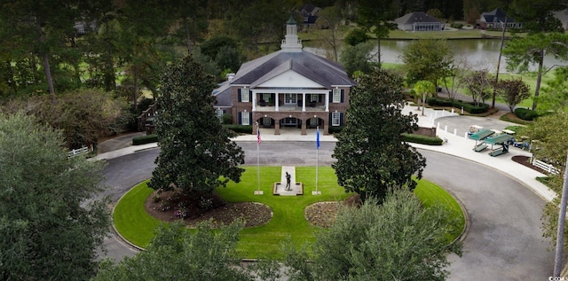 birds eye view of property with a water view