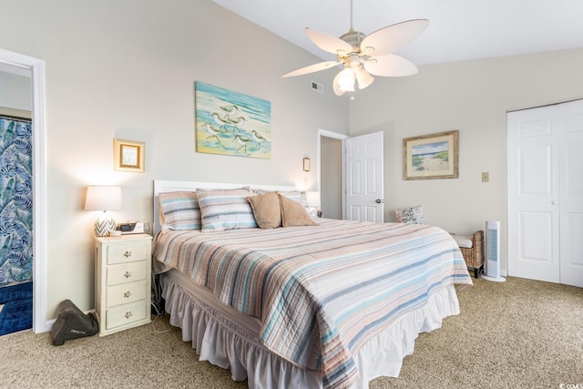 carpeted bedroom featuring ceiling fan and vaulted ceiling