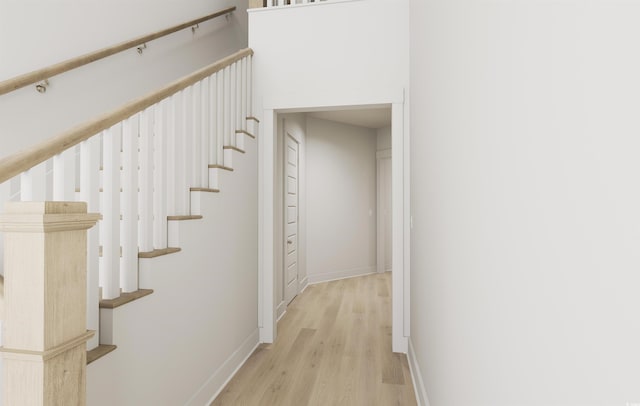 stairway featuring hardwood / wood-style floors