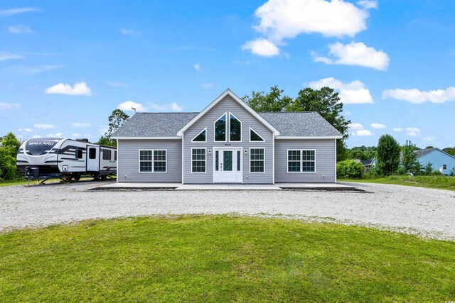 back of house with a lawn and french doors