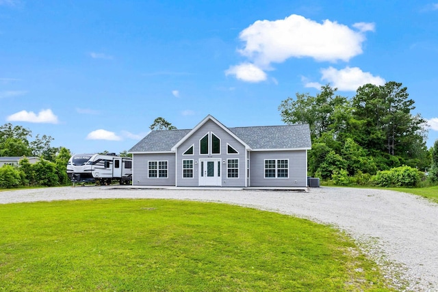 view of front of property featuring central AC unit and a front yard