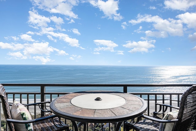 balcony featuring a water view