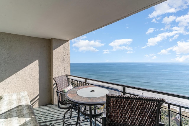 balcony featuring a water view