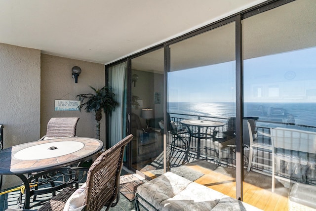 balcony featuring a water view