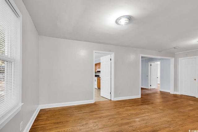 spare room featuring light wood-type flooring