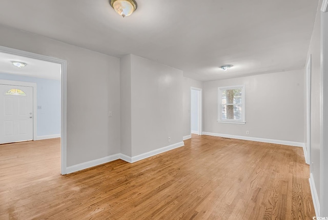 empty room with light hardwood / wood-style floors