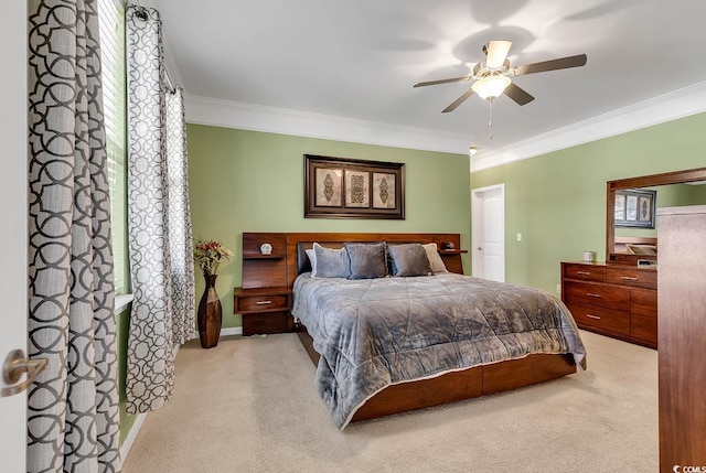 bedroom with ceiling fan, light colored carpet, and ornamental molding