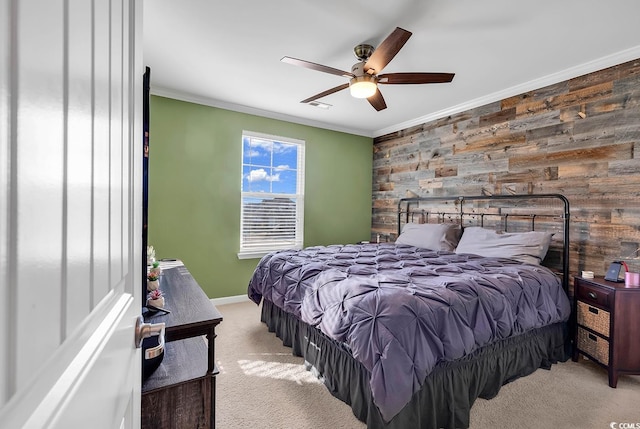 bedroom with ceiling fan, crown molding, and light colored carpet