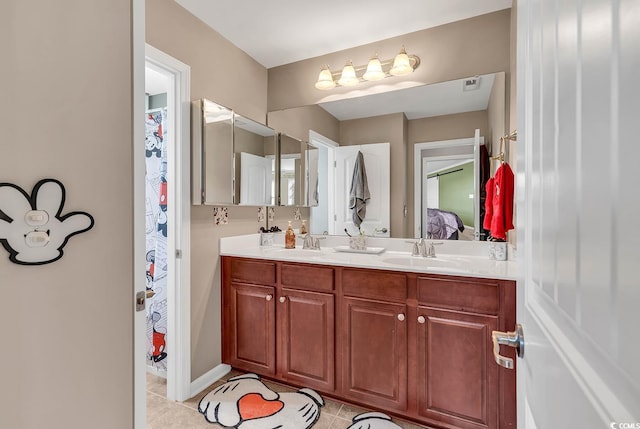 bathroom with vanity and tile patterned floors