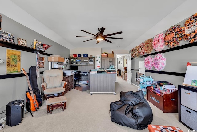 interior space featuring light carpet, vaulted ceiling, and ceiling fan