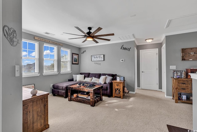 living room with ceiling fan, light colored carpet, and crown molding