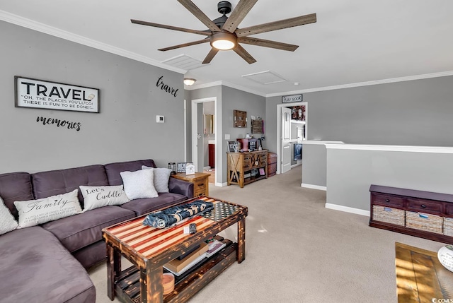 carpeted living room with ceiling fan and ornamental molding