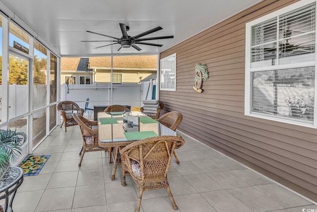 sunroom / solarium with ceiling fan