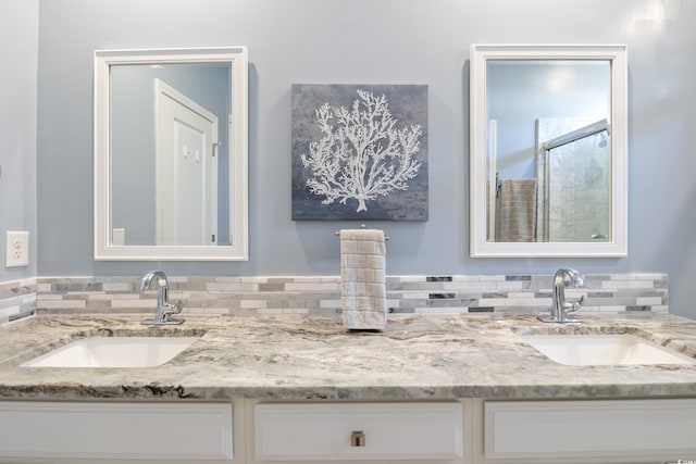 bathroom with vanity and an enclosed shower