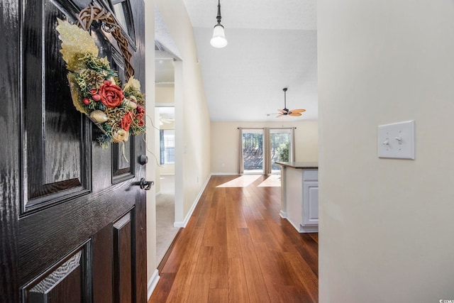 entrance foyer featuring ceiling fan, high vaulted ceiling, and dark hardwood / wood-style floors