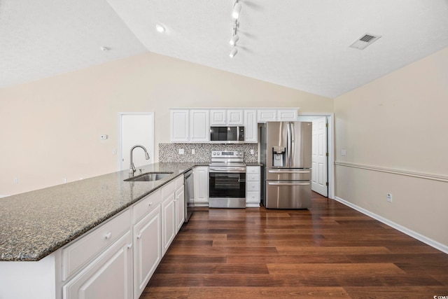 kitchen with dark wood-type flooring, sink, white cabinetry, kitchen peninsula, and stainless steel appliances