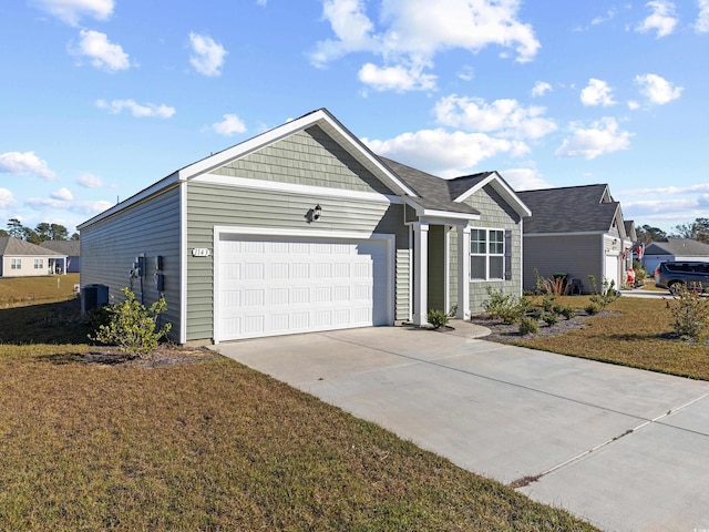 ranch-style home with a garage and a front lawn