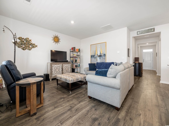 living room featuring dark wood-type flooring