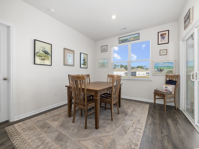 dining room featuring dark hardwood / wood-style flooring