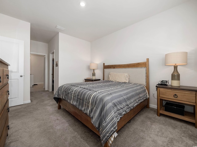 bedroom featuring light colored carpet