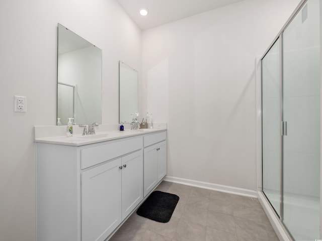 bathroom featuring tile patterned floors, vanity, and an enclosed shower