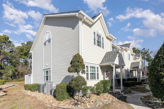 view of side of property with central AC