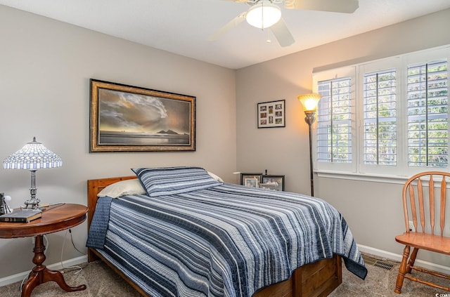 bedroom featuring ceiling fan and carpet