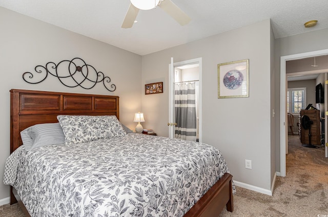 carpeted bedroom with connected bathroom and ceiling fan